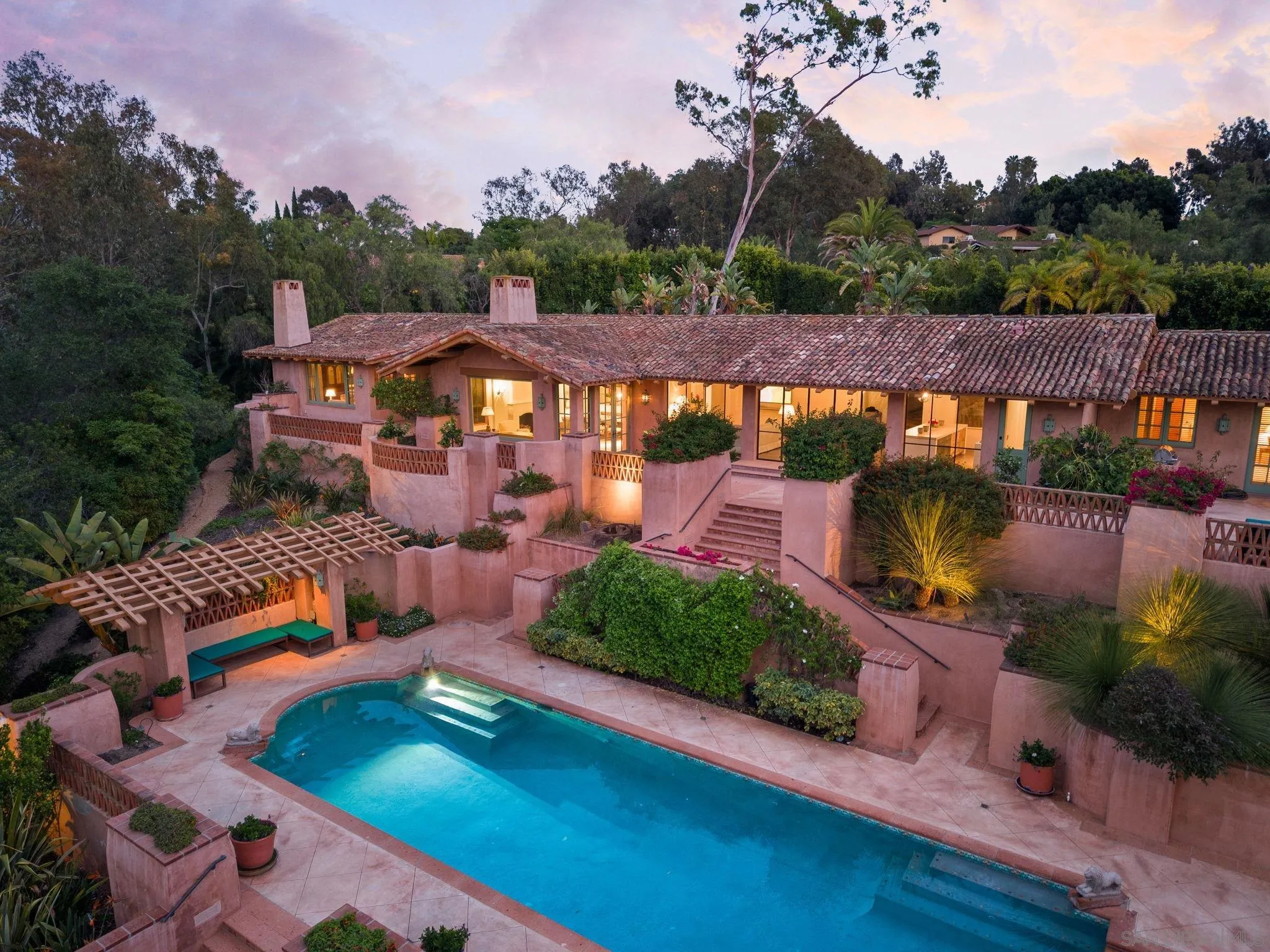an aerial view of a house with a garden