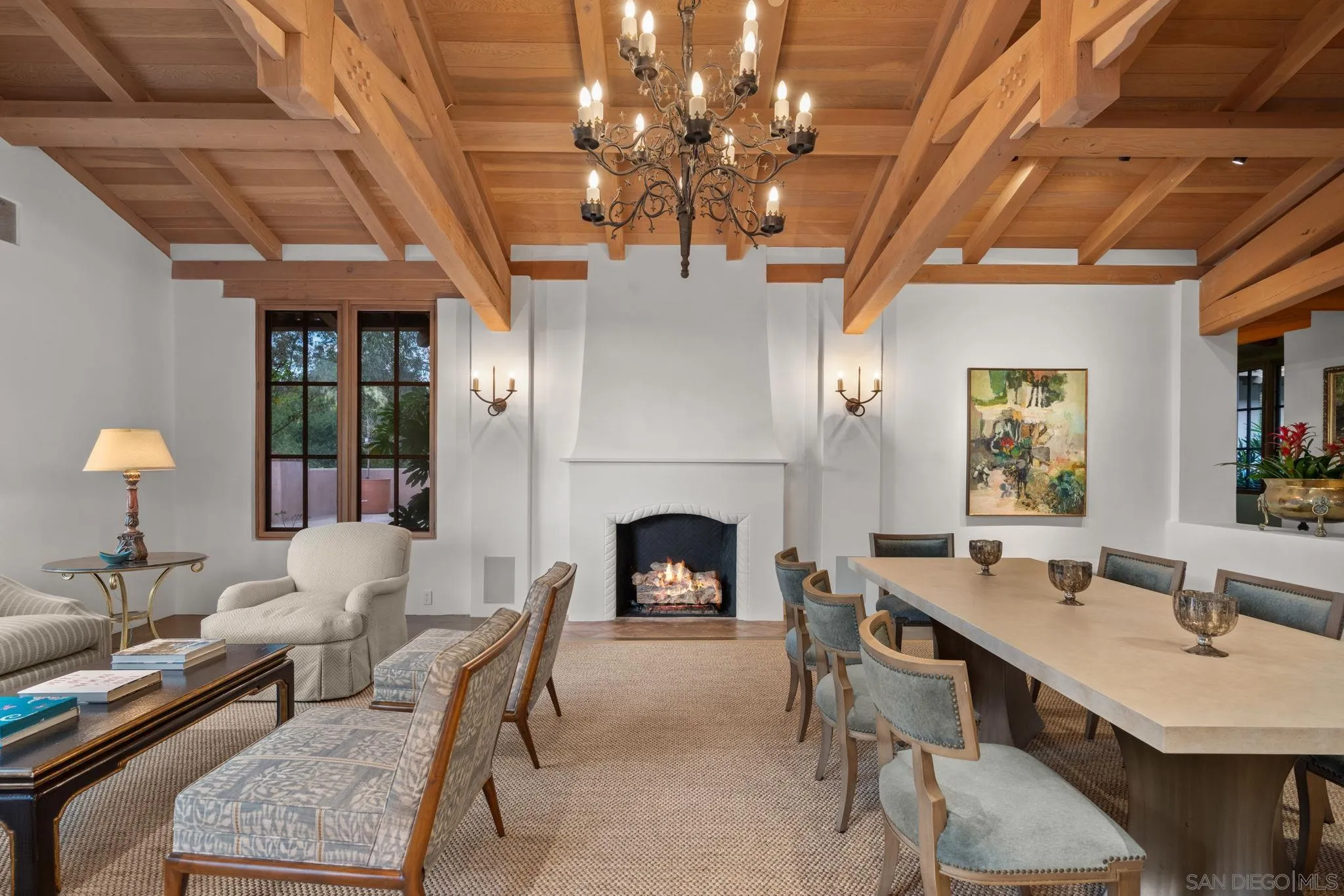 6002 Paseo Valencia Rancho Santa Fe, CA 92067 - Photo 13 of 33 a living room with furniture a chandelier and a fireplace