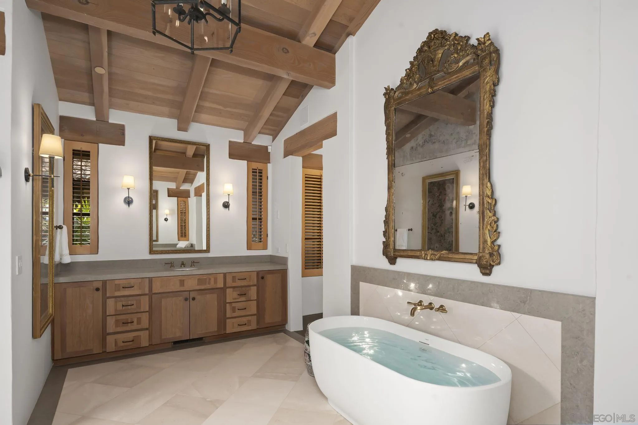 6002 Paseo Valencia Rancho Santa Fe, CA 92067 - Photo 18 of 33 a bathroom with a sink and a mirror