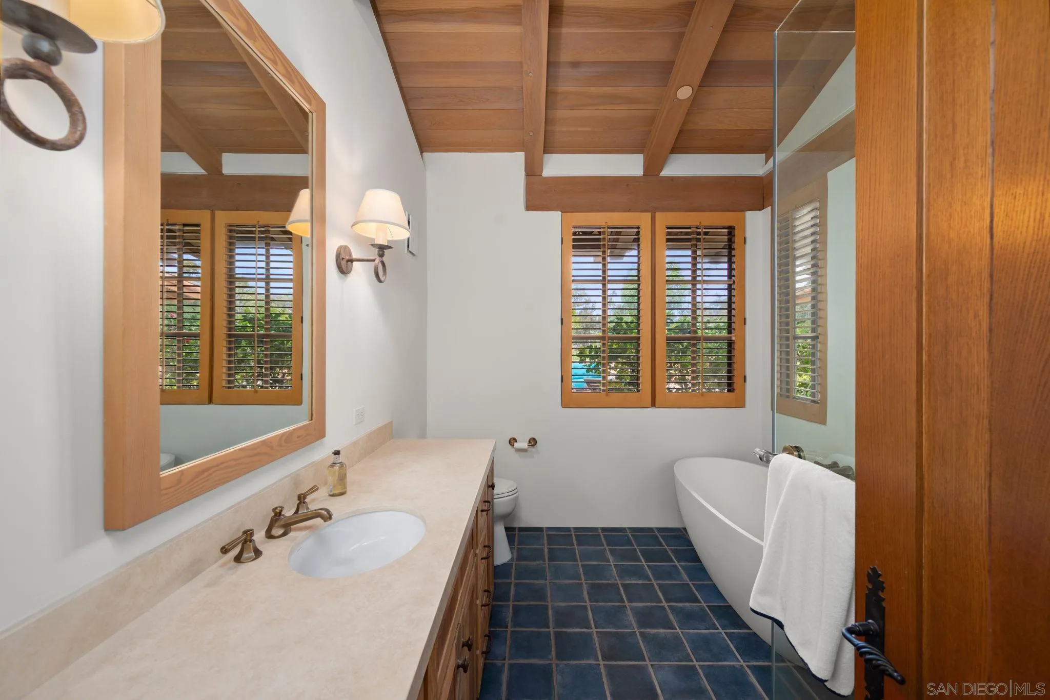 6002 Paseo Valencia Rancho Santa Fe, CA 92067 - Photo 29 of 33 a bathroom with a sink a mirror and a bathtub