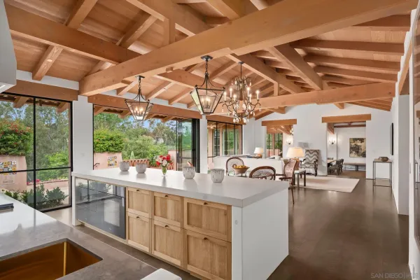 a very nice looking room with a large window and chandelier
