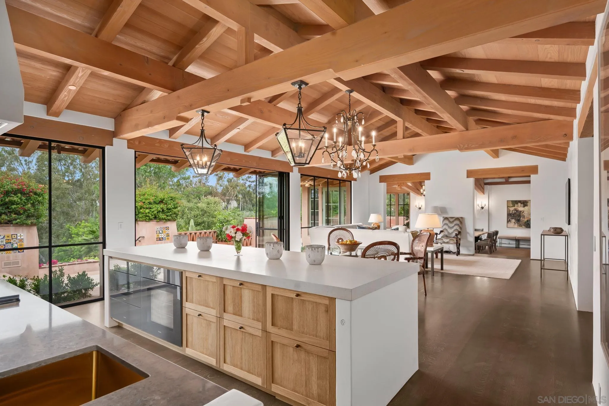 6002 Paseo Valencia Rancho Santa Fe, CA 92067 - Photo 3 of 33 a very nice looking room with a large window and chandelier