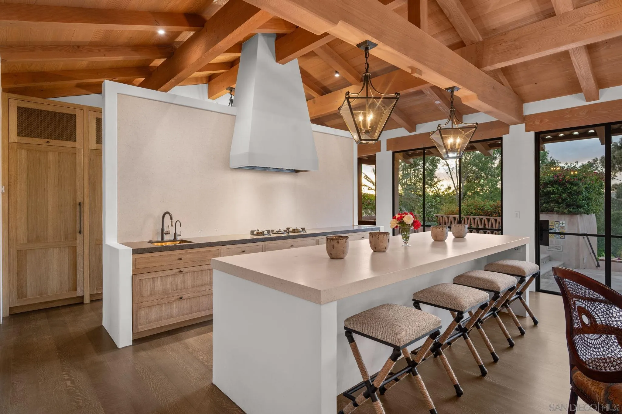 6002 Paseo Valencia Rancho Santa Fe, CA 92067 - Photo 6 of 33 a kitchen with stainless steel appliances granite countertop a stove a sink and a refrigerator