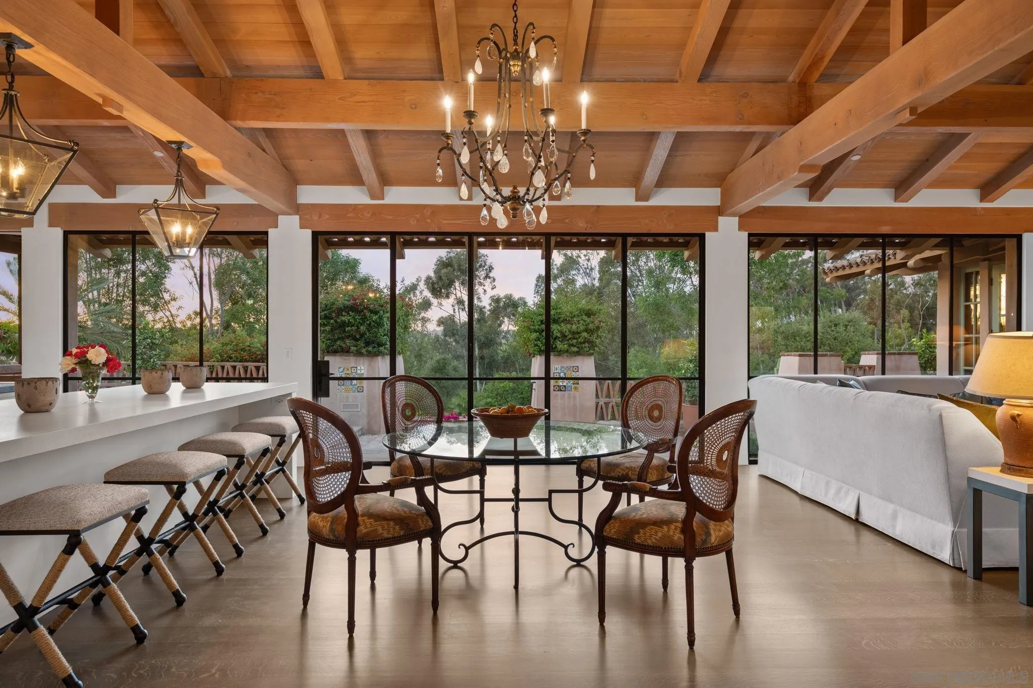 6002 Paseo Valencia Rancho Santa Fe, CA 92067 - Photo 7 of 33 a view of a dining room with furniture large windows and wooden floor