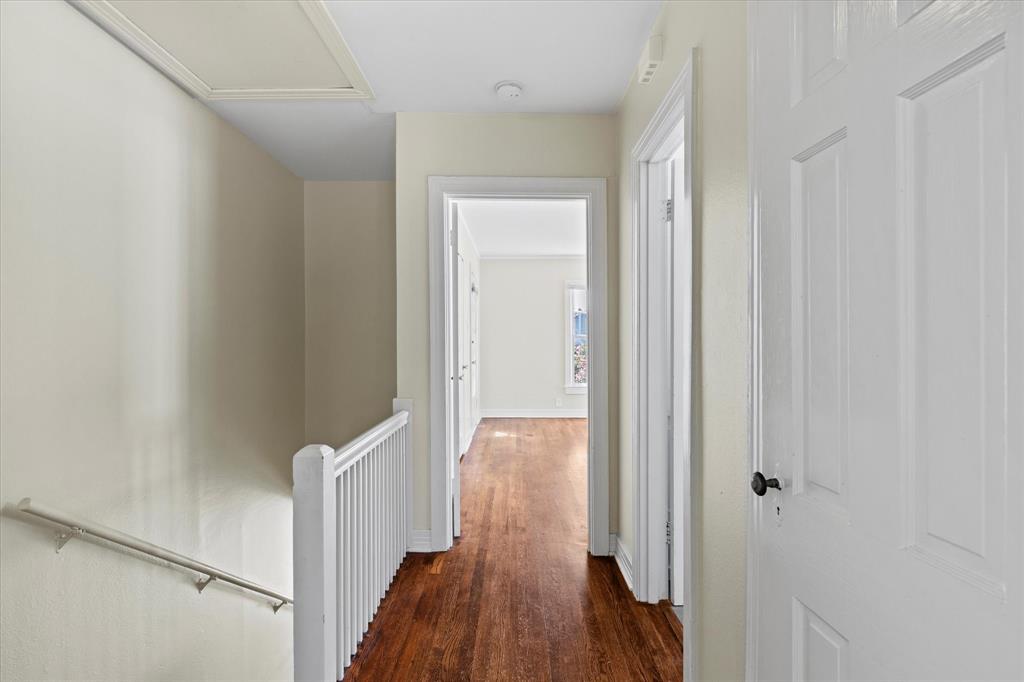 5927 Lewis Street Dallas, TX 75206 - Photo 11 of 19 a view of a hallway with wooden floor and staircase