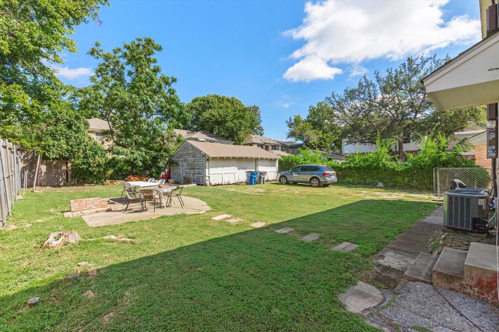 5927 Lewis Street Dallas, TX 75206 - Photo 17 of 19 a view of a house with backyard sitting area and garden