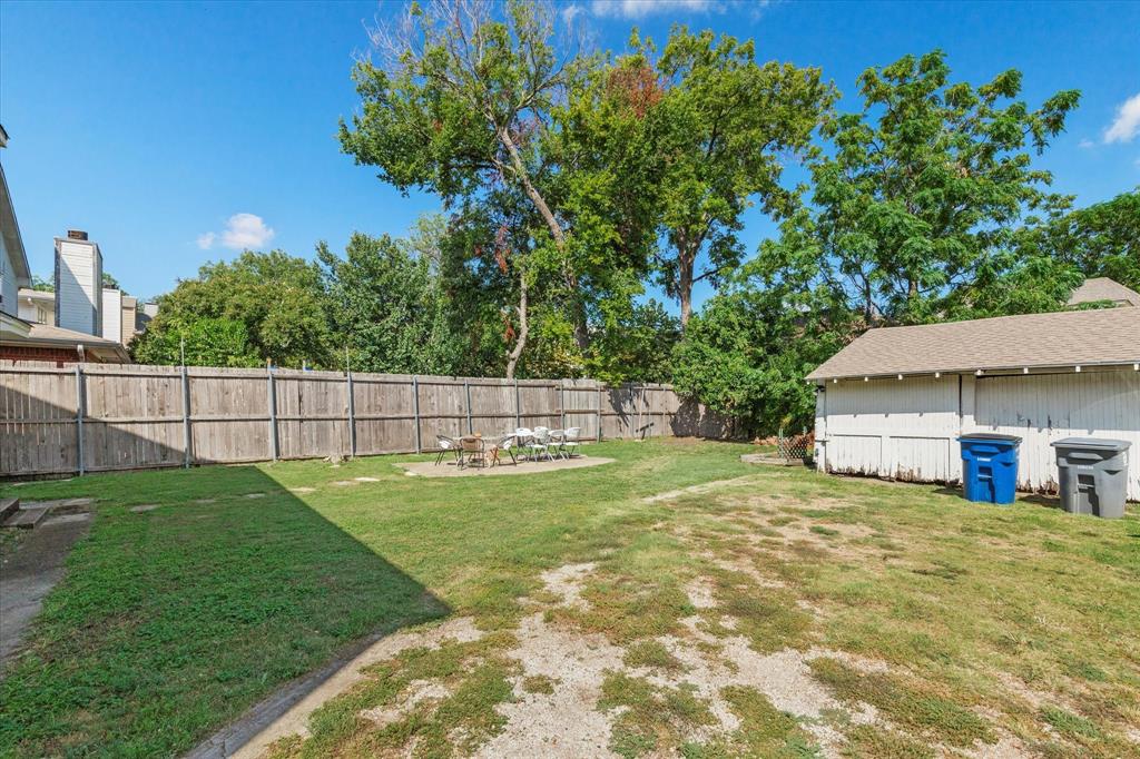 5927 Lewis Street Dallas, TX 75206 - Photo 18 of 19 a view of a backyard with a garden