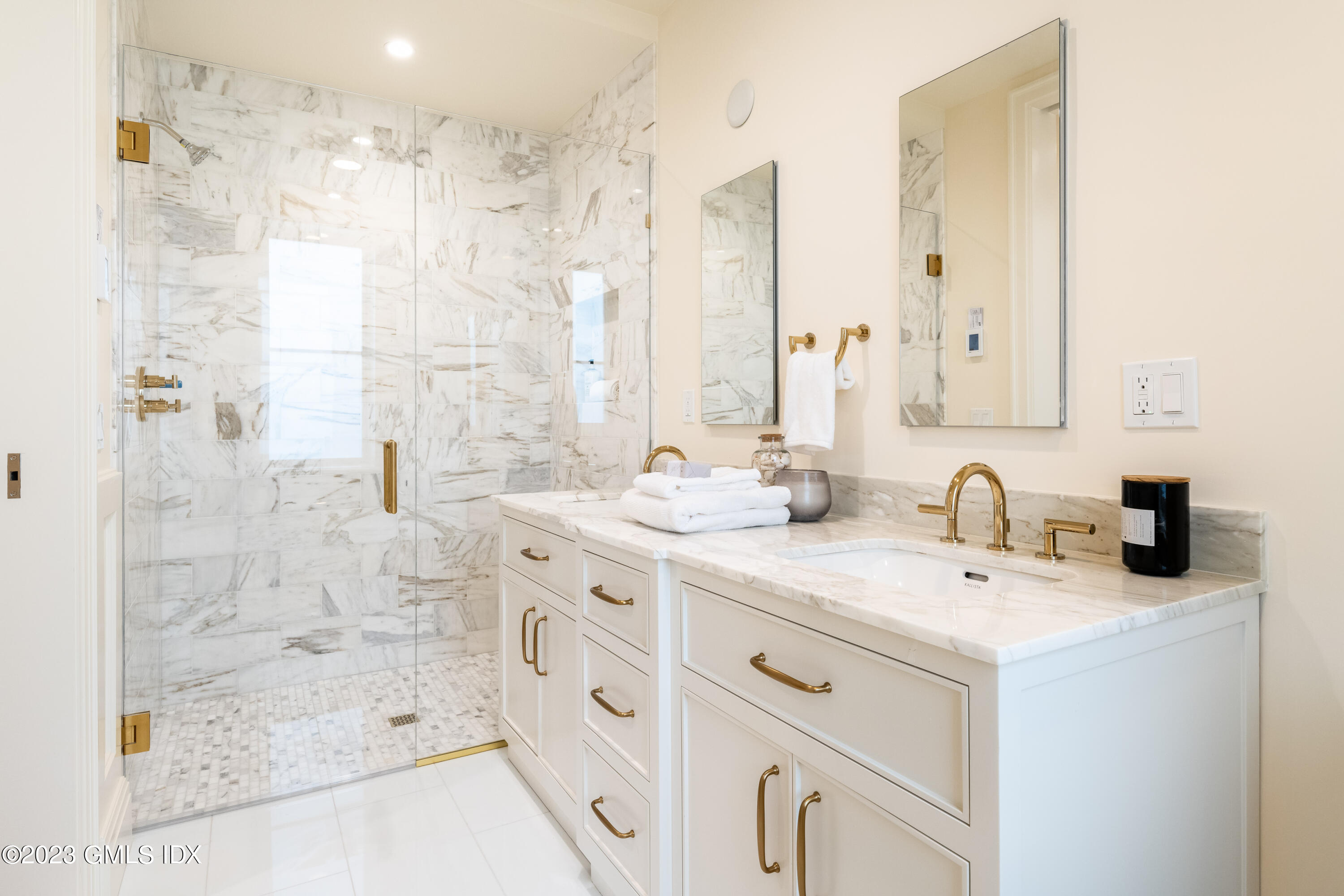 62 Mason Street, Unit 2W Greenwich, CT 06830 - Photo 11 of 15 a bathroom with a double vanity sink mirror and shower