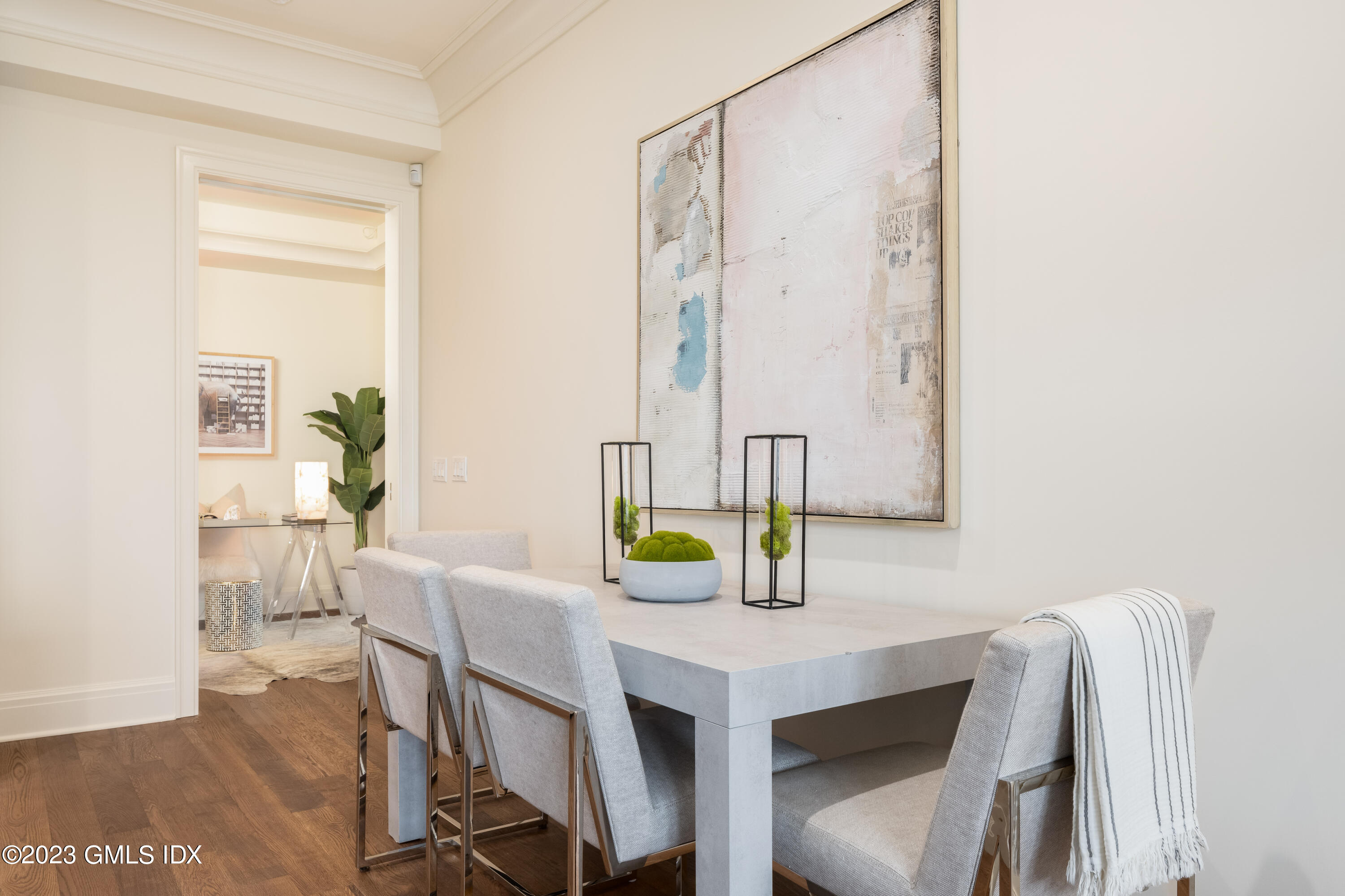 62 Mason Street, Unit 2W Greenwich, CT 06830 - Photo 7 of 15 a view of a dining room with furniture and a potted plant