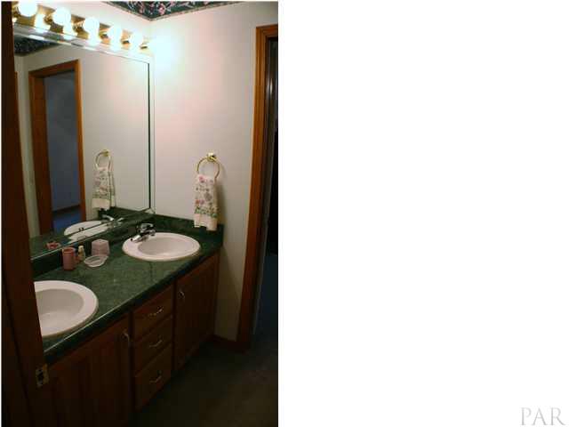 6012 Saddle Club Road Pace, FL 32571 - Photo 16 of 24 Jack and Jill bath upstairs between bedrooms. Double vanity ~ WAter closet and shower room to the right.