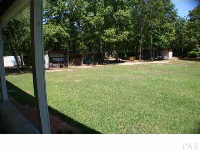 6012 Saddle Club Road Pace, FL 32571 - Photo 21 of 24 View from the back covered patio to the left.