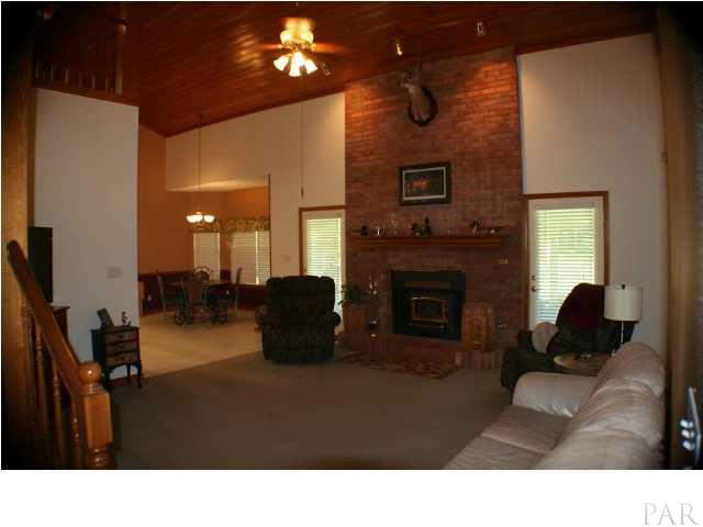 6012 Saddle Club Road Pace, FL 32571 - Photo 6 of 24 Open concept with french doors leaning onto back covered patio from breakfast, great room and master bedroom.