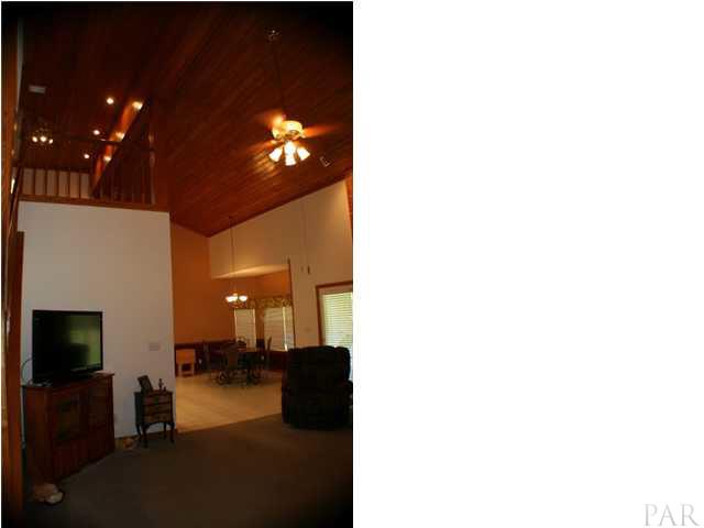6012 Saddle Club Road Pace, FL 32571 - Photo 8 of 24 Loft area is open to the down stairs.