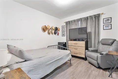 a bedroom with a bed and furniture