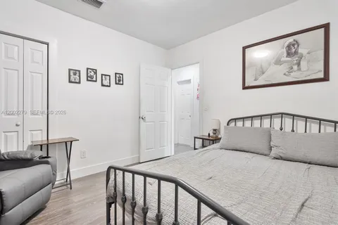 a bedroom with a large bed and furniture