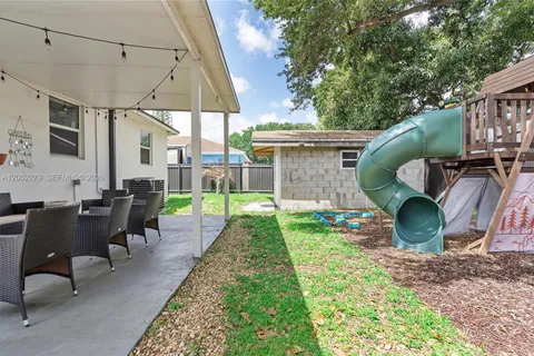 a view of yard with patio
