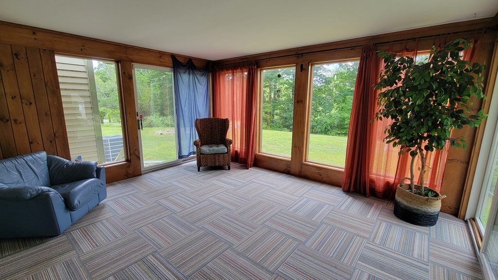 9 David Drive Pelham, NH 03076 - Photo 13 of 42 a view of livingroom with furniture and floor to ceiling window