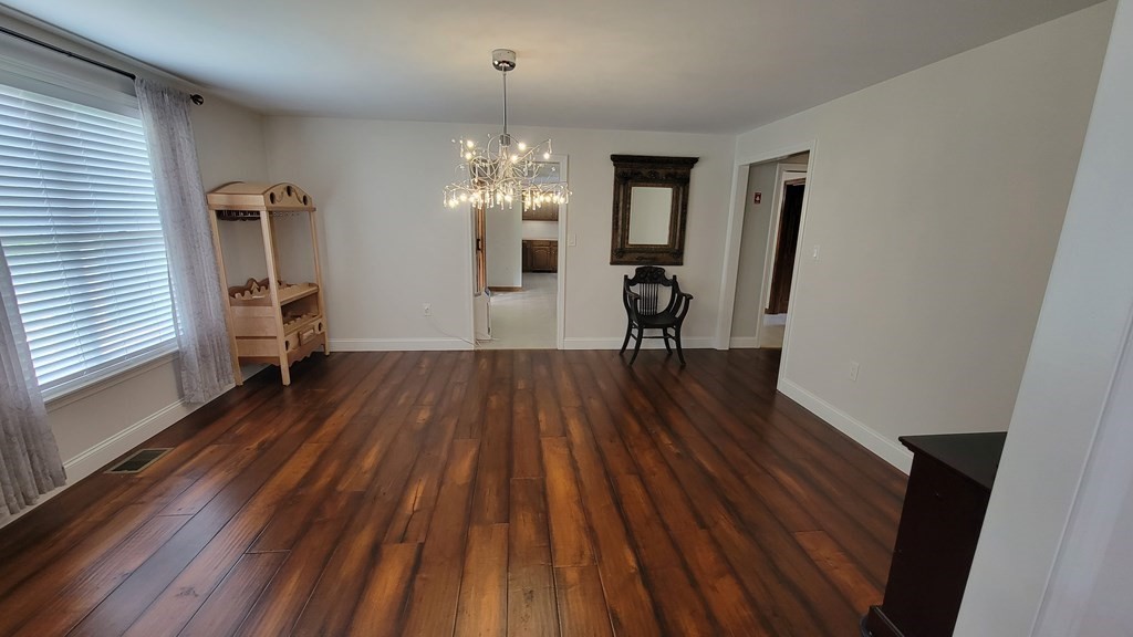 9 David Drive Pelham, NH 03076 - Photo 16 of 42 wooden floor in an empty room with a window