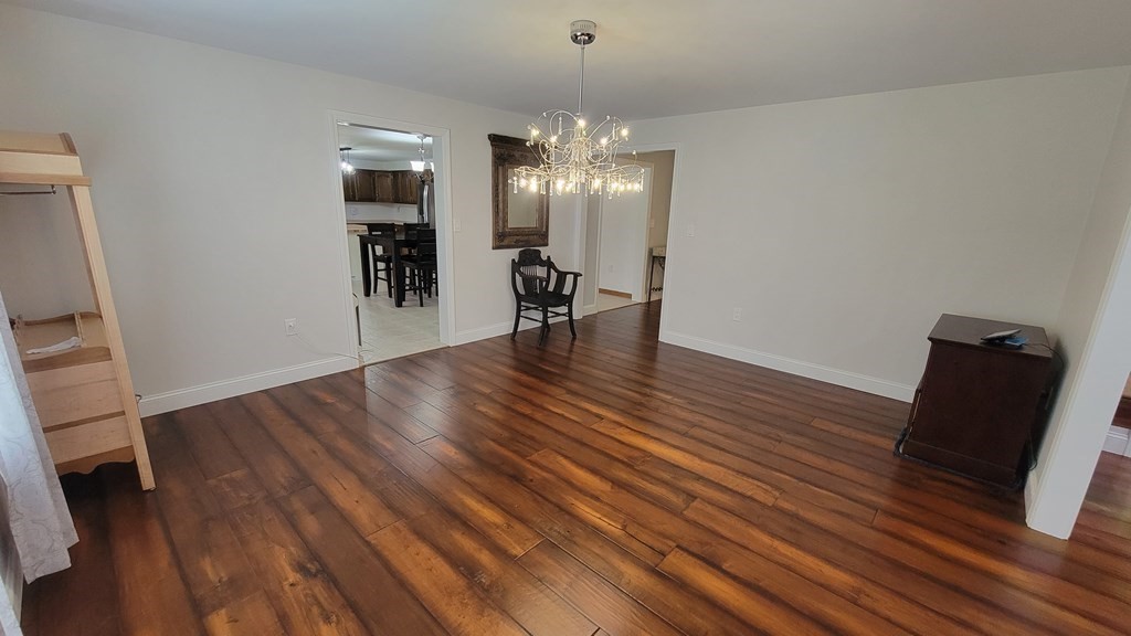 9 David Drive Pelham, NH 03076 - Photo 17 of 42 a view of a room with wooden floor and a ceiling fan