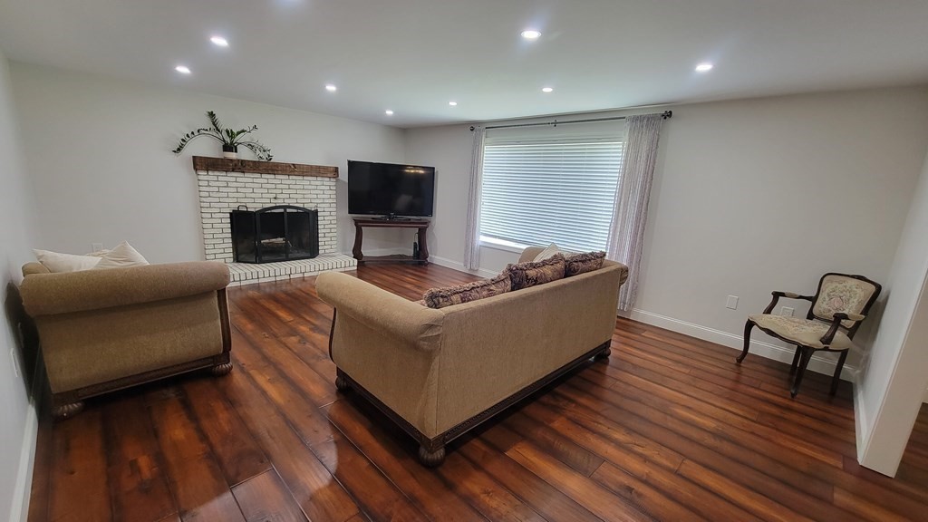 9 David Drive Pelham, NH 03076 - Photo 19 of 42 a living room with furniture and a fireplace