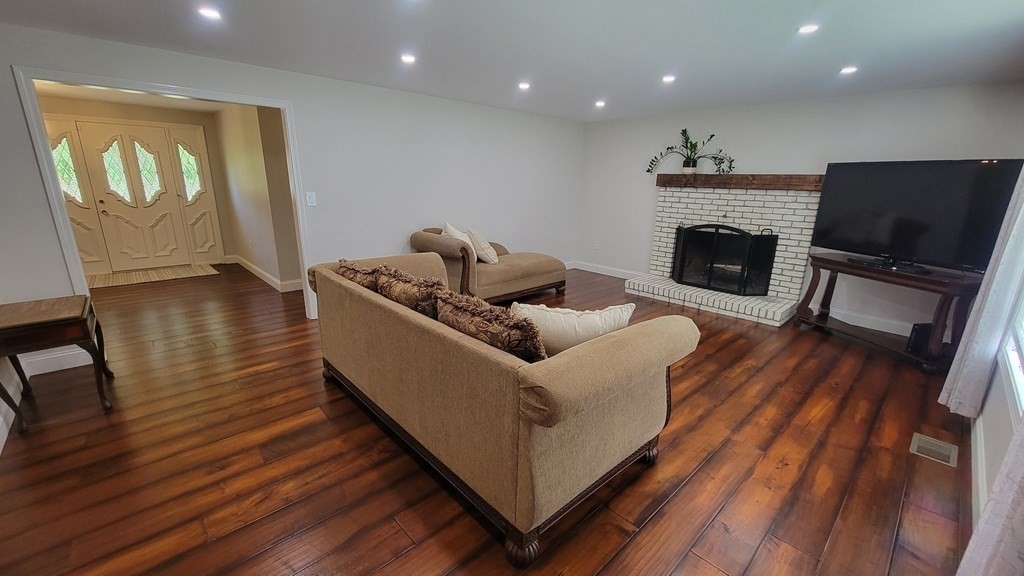 9 David Drive Pelham, NH 03076 - Photo 20 of 42 a living room with furniture and a fireplace