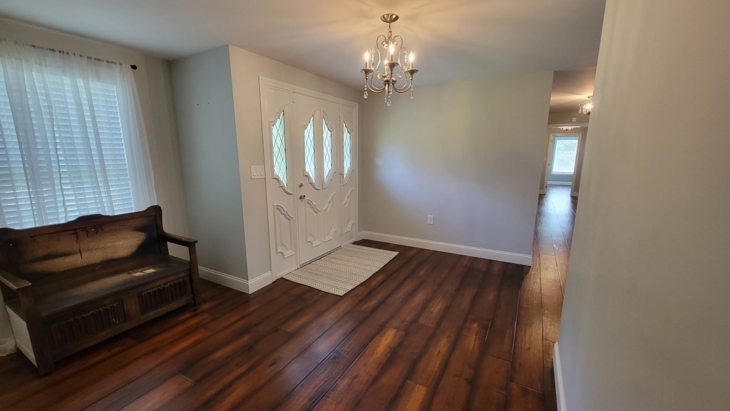 9 David Drive Pelham, NH 03076 - Photo 21 of 42 a view of a livingroom with wooden floor and furniture