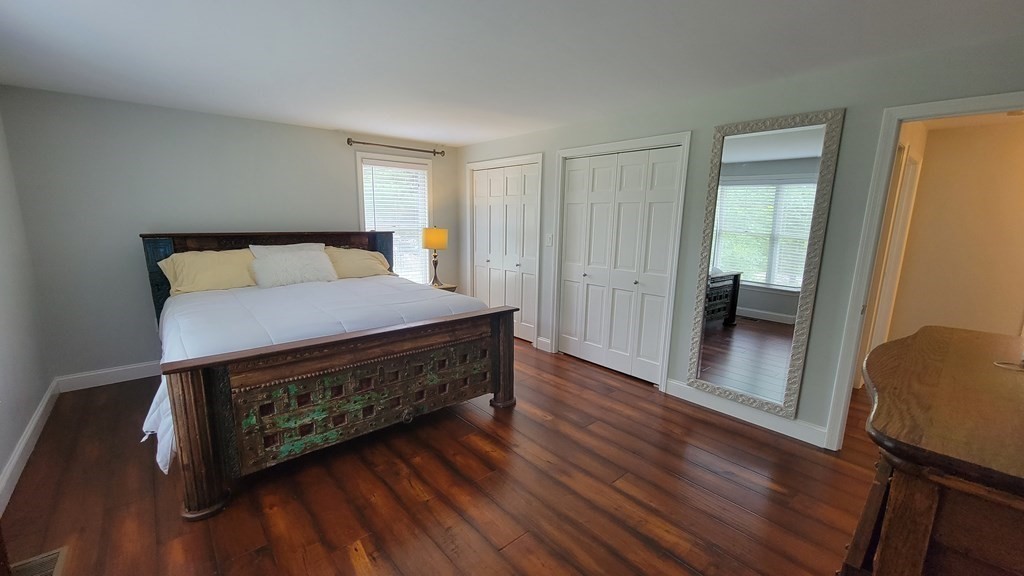 9 David Drive Pelham, NH 03076 - Photo 24 of 42 a living room with a bed furniture and a wooden floor