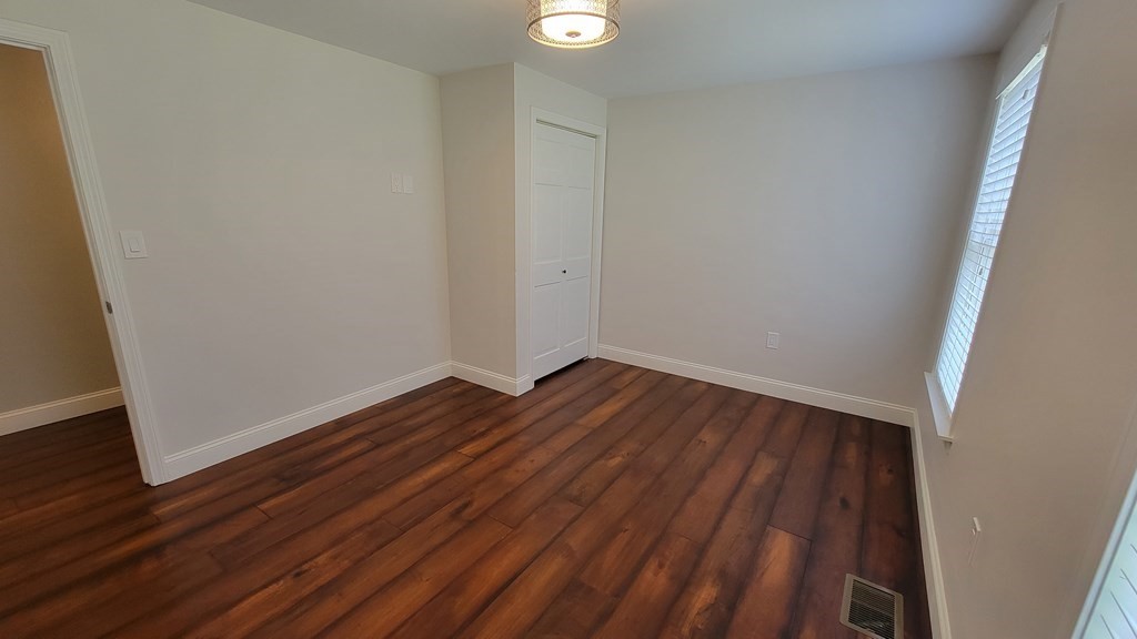 9 David Drive Pelham, NH 03076 - Photo 28 of 42 a view of a room with wooden floor and white walls