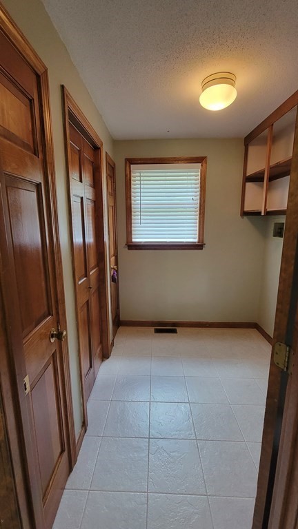 9 David Drive Pelham, NH 03076 - Photo 29 of 42 a view of an empty room with wooden floor and a window