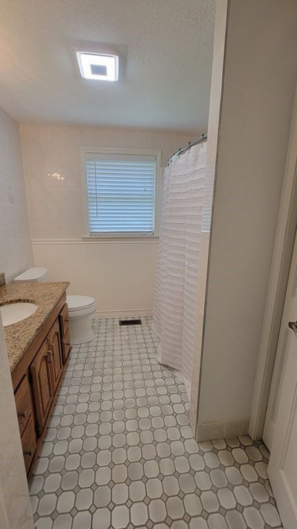 9 David Drive Pelham, NH 03076 - Photo 33 of 42 a bathroom with a sink a toilet and a mirror