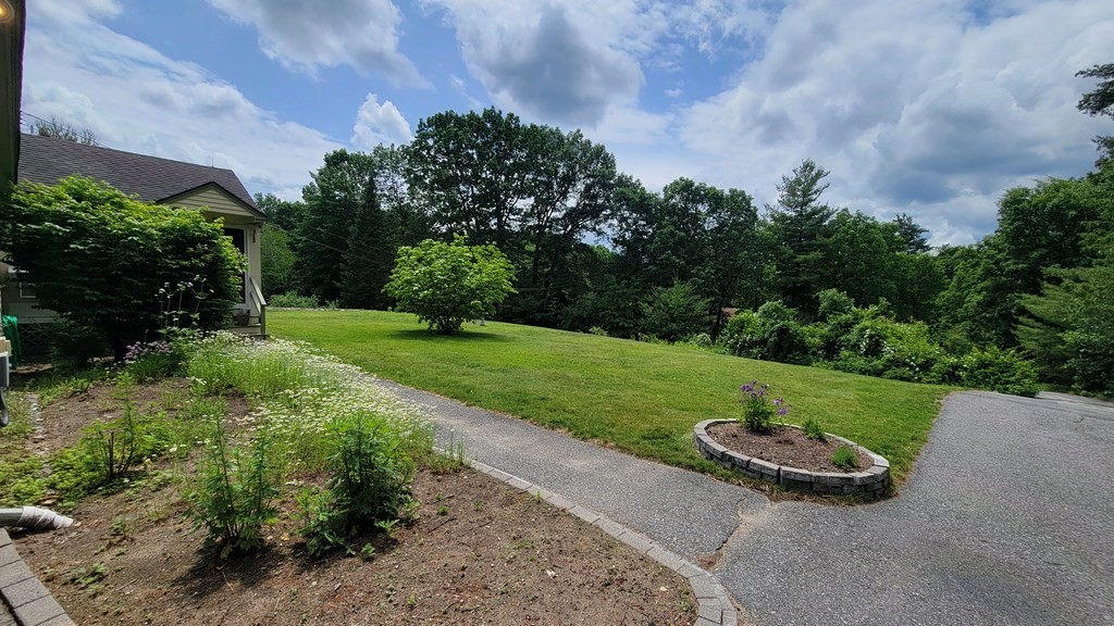 9 David Drive Pelham, NH 03076 - Photo 39 of 42 a view of a table and chairs in the garden