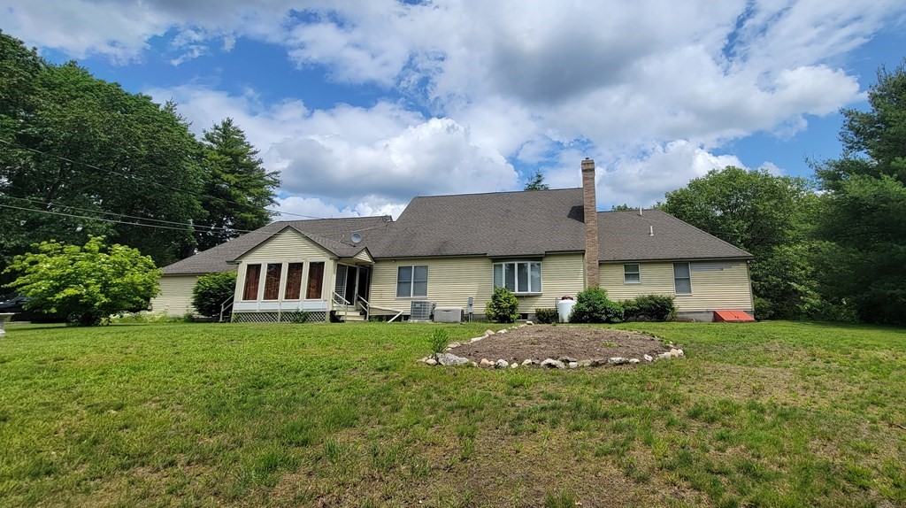9 David Drive Pelham, NH 03076 - Photo 42 of 42 a front view of a house with garden