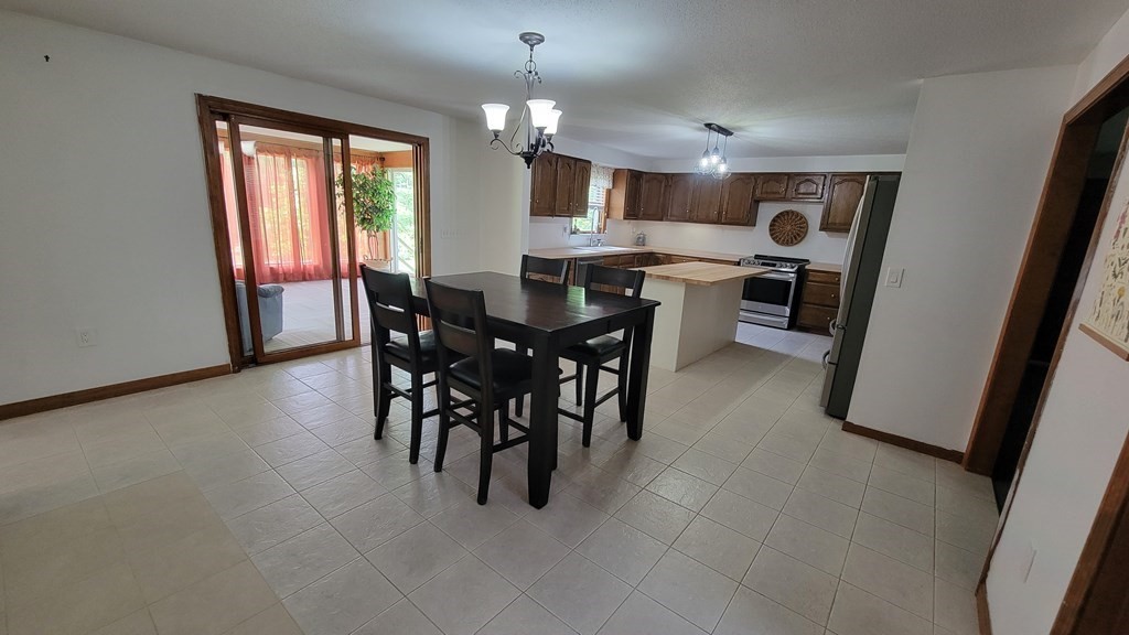 9 David Drive Pelham, NH 03076 - Photo 9 of 42 a view of a dining room with furniture window and outside view