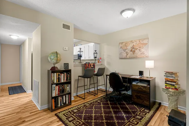 a kitchen with stainless steel appliances a refrigerator sink and cabinets