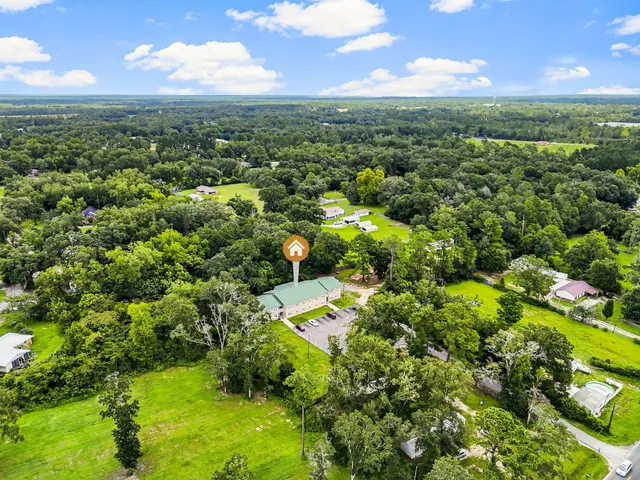 a view of a garden with a building in the background