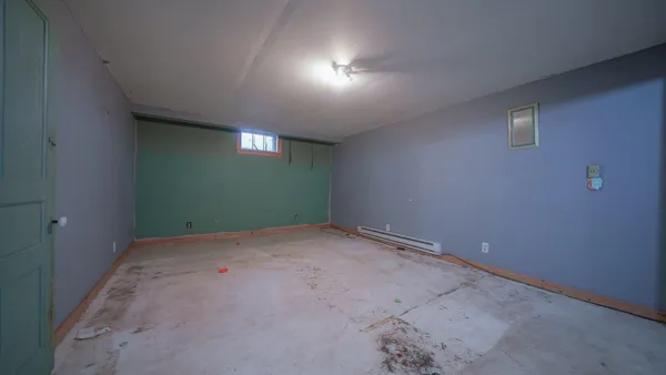 a kitchen with stainless steel appliances granite countertop wooden cabinets a sink and a window