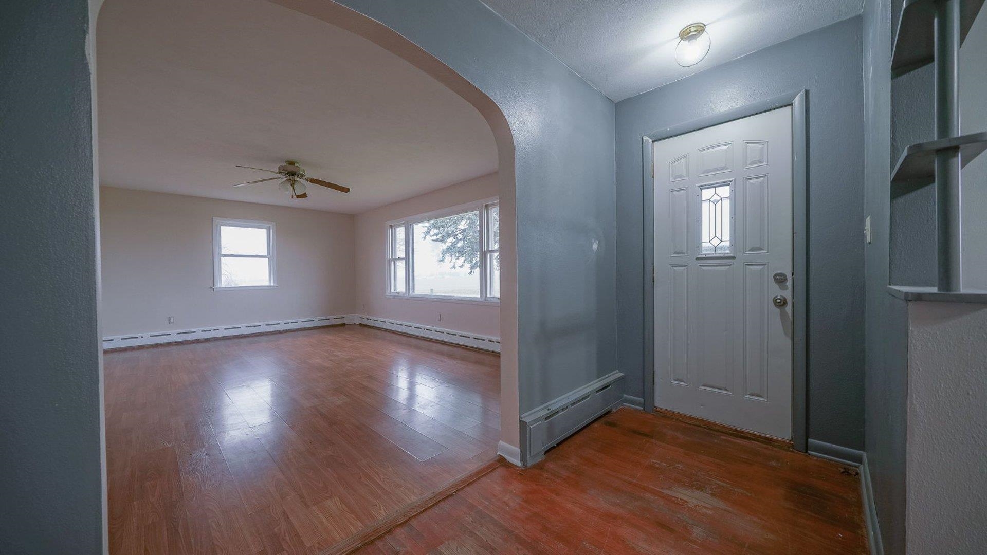 2610 Klinger Road Pecatonica, IL 61063 - Photo 26 of 53 an empty room with wooden floor and windows