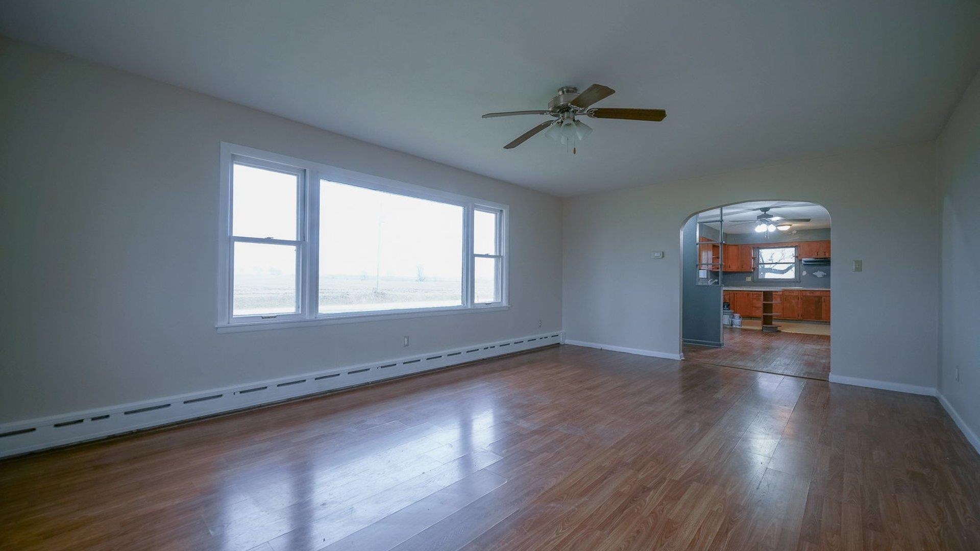 2610 Klinger Road Pecatonica, IL 61063 - Photo 30 of 53 a view of a livingroom with wooden floor and a window