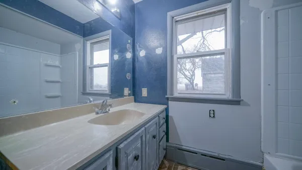 a view of empty room with wooden ceiling