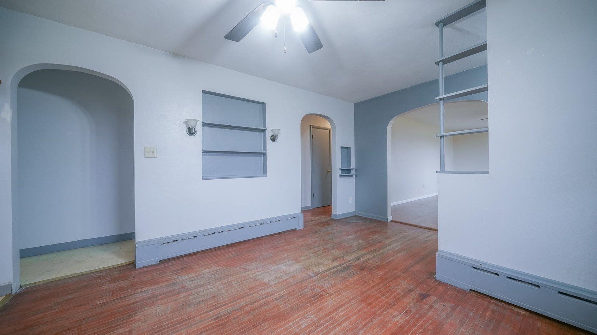 2610 Klinger Road Pecatonica, IL 61063 - Photo 33 of 53 an empty room with wooden floor cabinet and windows