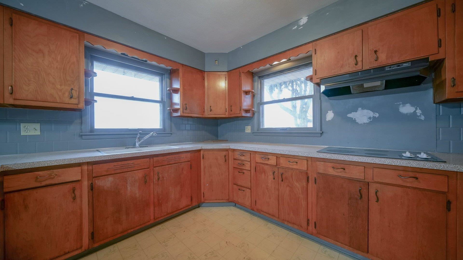 2610 Klinger Road Pecatonica, IL 61063 - Photo 37 of 53 a kitchen with stainless steel appliances granite countertop wooden cabinets a sink and a window
