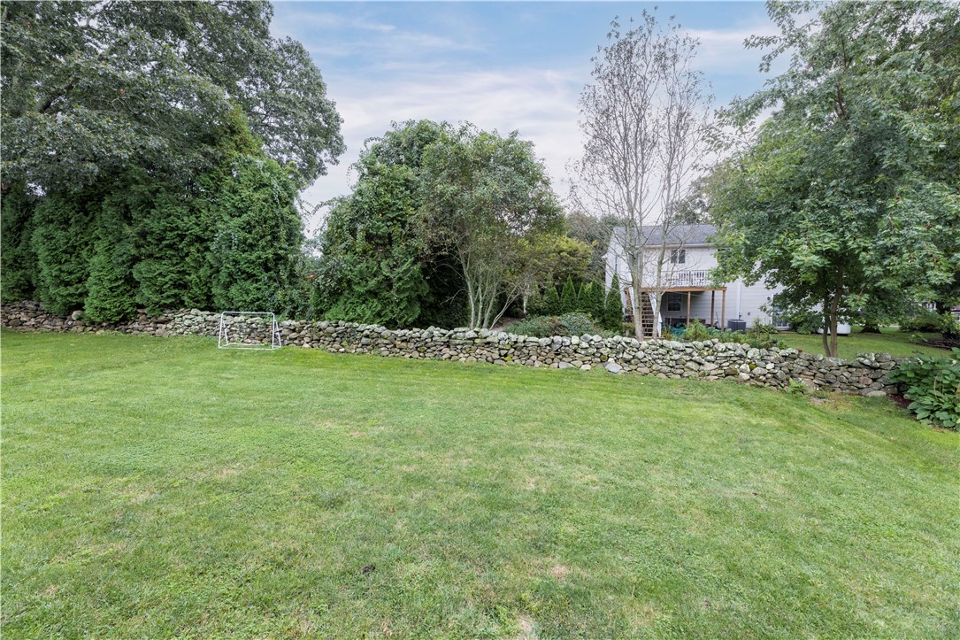 18 Betony Road Narragansett, RI 02874 - Photo 26 of 31 Backyard / Historic stone wall