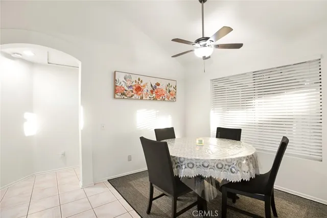 a view of a dining room with furniture and a window