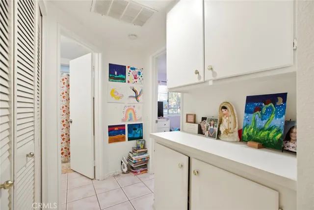a kitchen with stainless steel appliances cabinets and a window