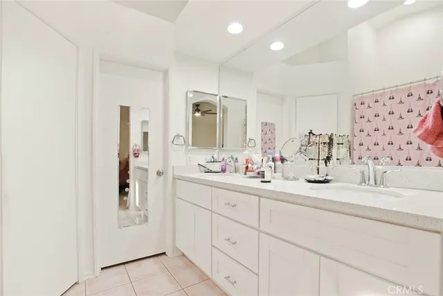 a bathroom with a double vanity sink mirror and double