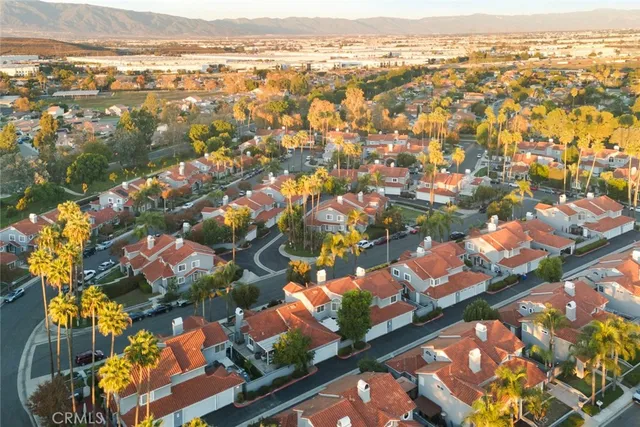 an aerial view of residential houses with outdoor space