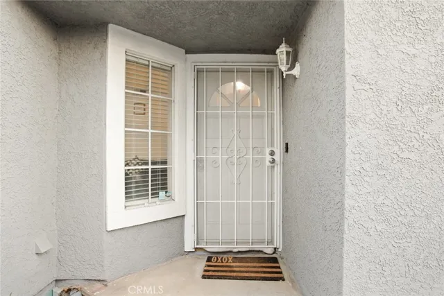 a view of room with wooden floor and a window