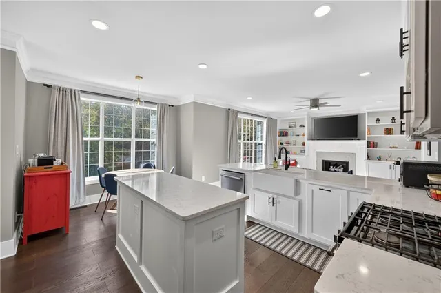a kitchen with sink a stove and refrigerator