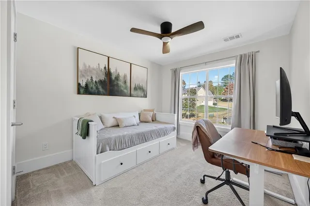 a bedroom with furniture and a window