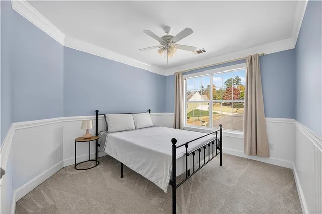 a bedroom with a bed and a table